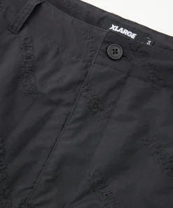 ALLOVER LOGO PATTERN EMBROIDERED NYLON PANTS